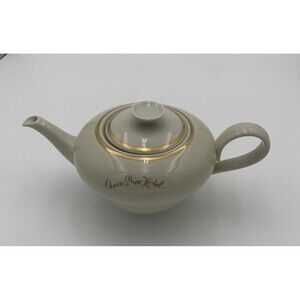 Vintage Rhenania Western Germany Teapot. Poreclain with gold trim around lid.